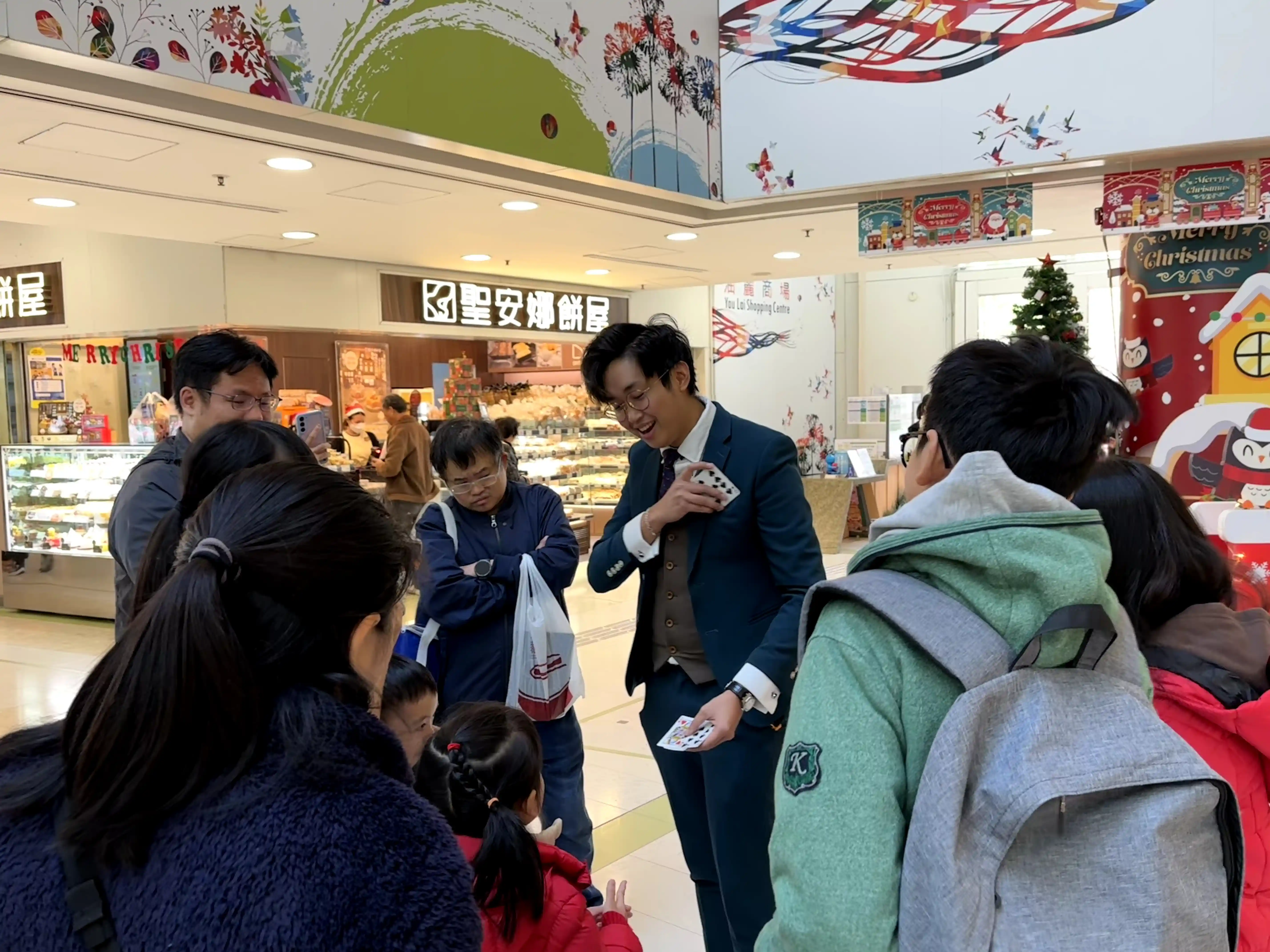 Strolling magician in a crowd